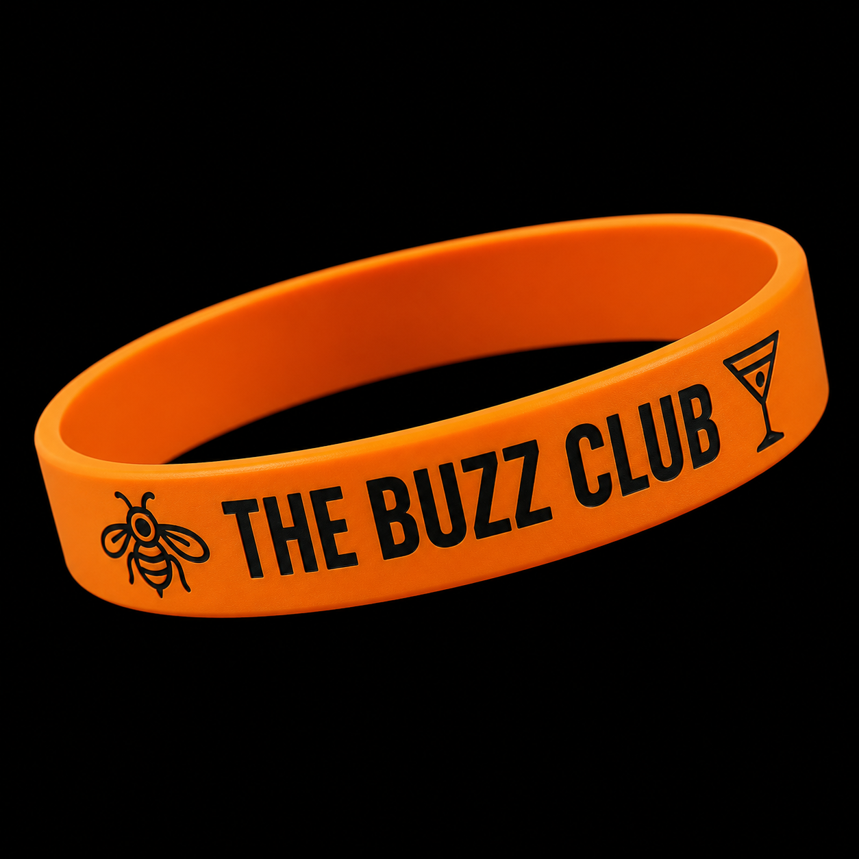 Orange Buzz Club friendship and fun wristband on black background